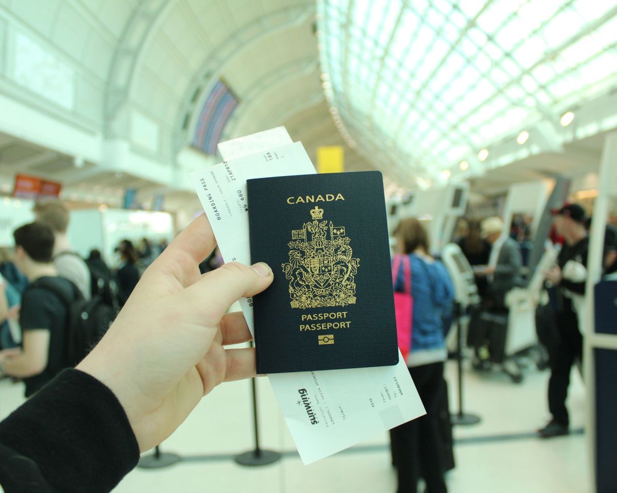 Traveller holding a Canadian passport at the airport