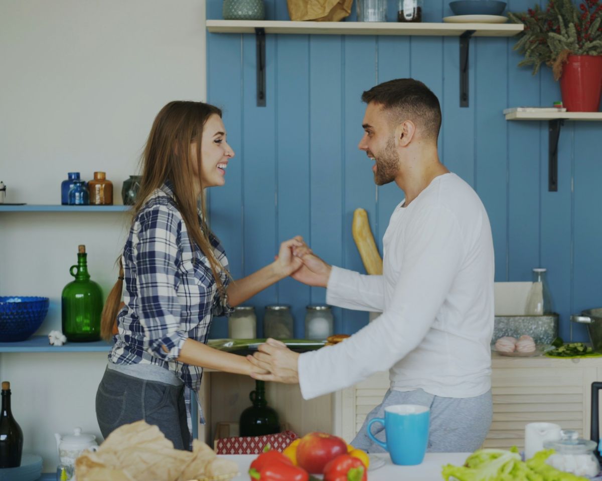 Couple together in their kitchen at home