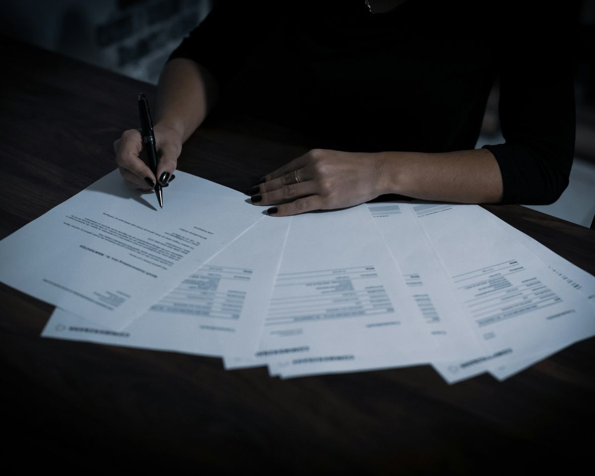 Person reviewing documents at a table